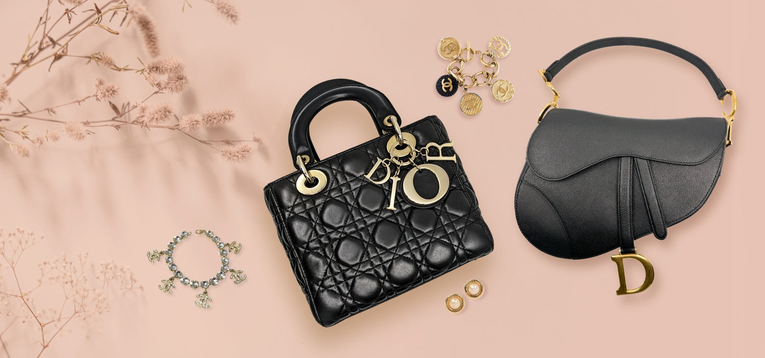 An iconic Dior bags flanked by Chanel accessories with light-pink background.