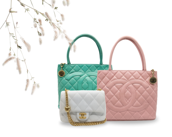 An iconic Chanel tote and cross body bags with light-gray background.