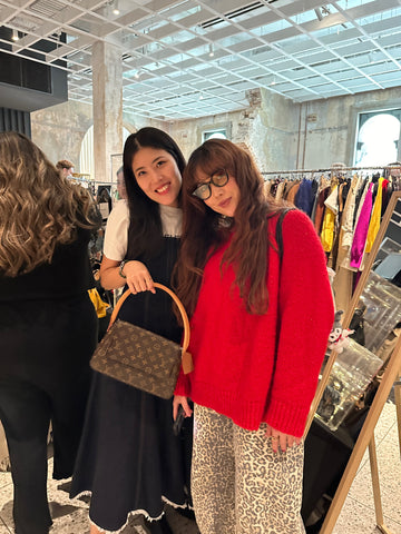 Photo showing the store owner and customer in the pop up event.