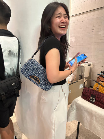 Photo showing the smiling customer in the pop up event