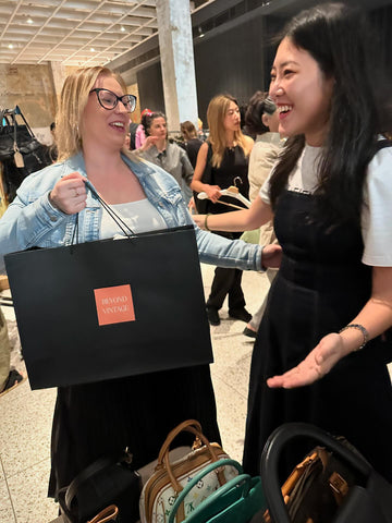 Photo showing the store owner and a smiling customer in the pop up event